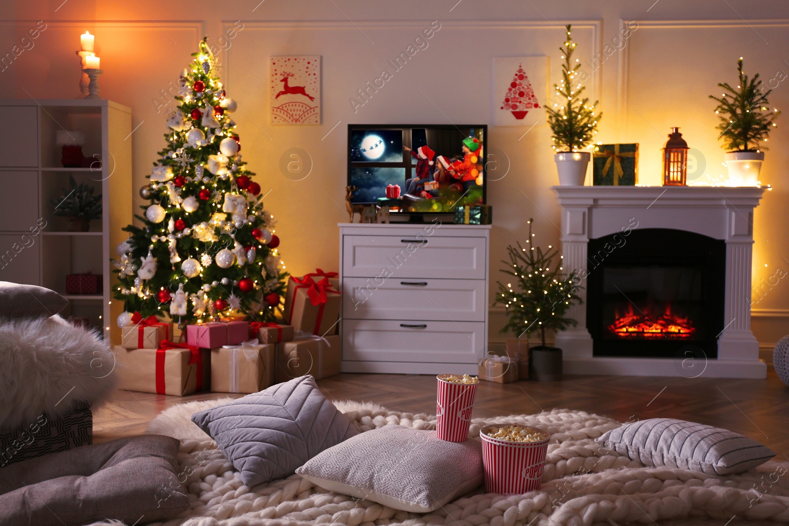Stylish living room interior with TV set, Christmas tree and fireplace Image of Stylish living room interior with TV set, Christmas tree and fireplace