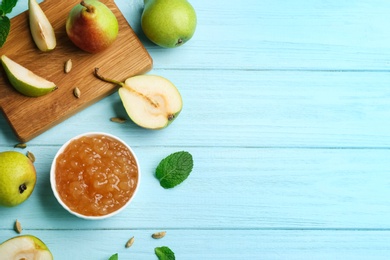 Tasty homemade pear jam and fresh fruits on light blue wooden table, flat lay. Space for text Photo of Tasty homemade pear jam and fresh fruits on light blue wooden table, flat lay. Space for text