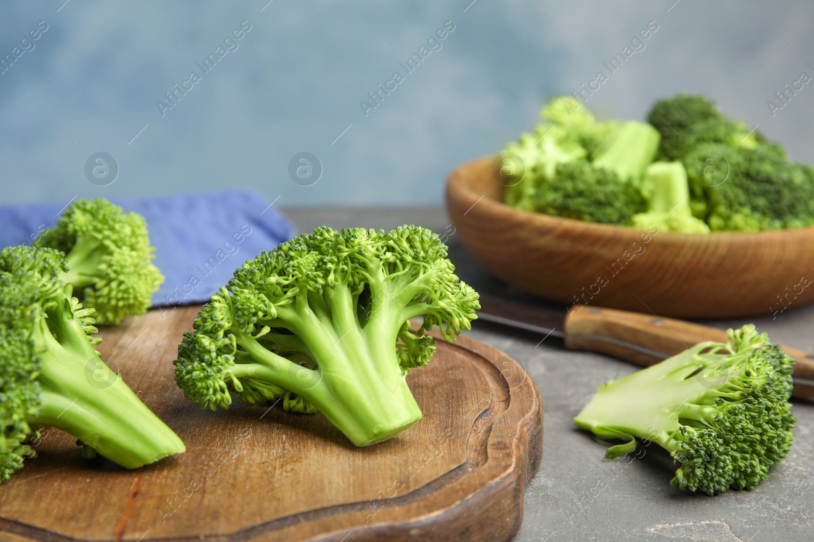 Fresh green broccoli on grey table. Organic food Photo of Fresh green broccoli on grey table. Organic food