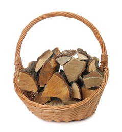 Wicker basket with firewood on white background Photo of Wicker basket with firewood on white background