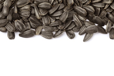Raw sunflower seeds on white background, top view Photo of Raw sunflower seeds on white background, top view