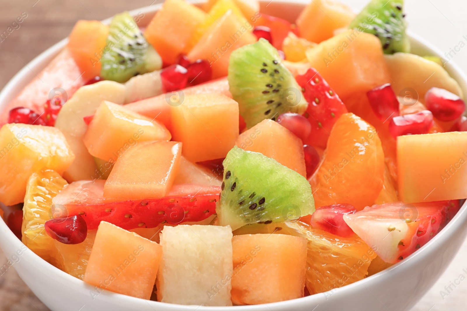 Bowl with fresh cut fruits, closeup Photo of Bowl with fresh cut fruits, closeup
