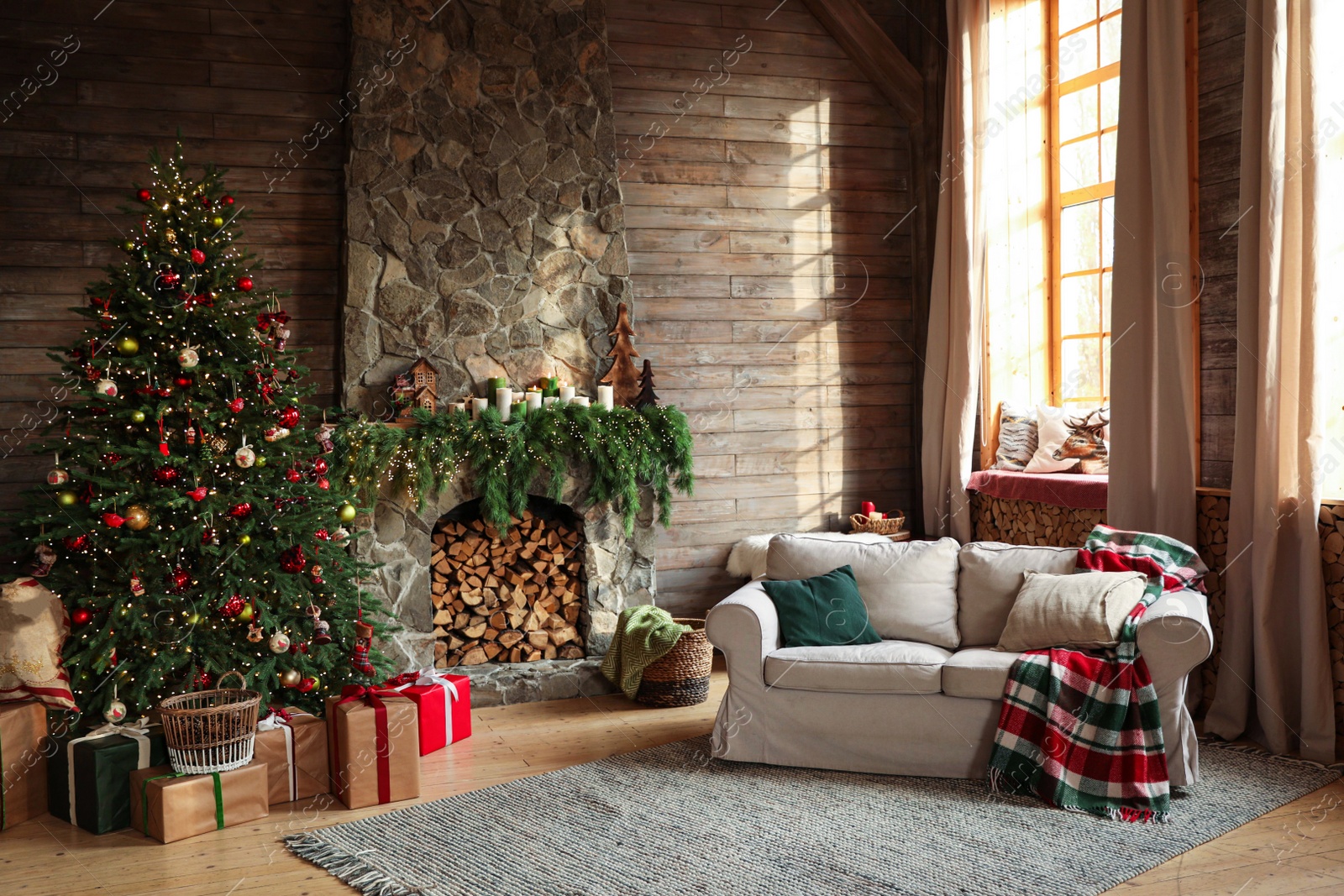 Photo of Festive interior with decorated Christmas tree and fireplace
