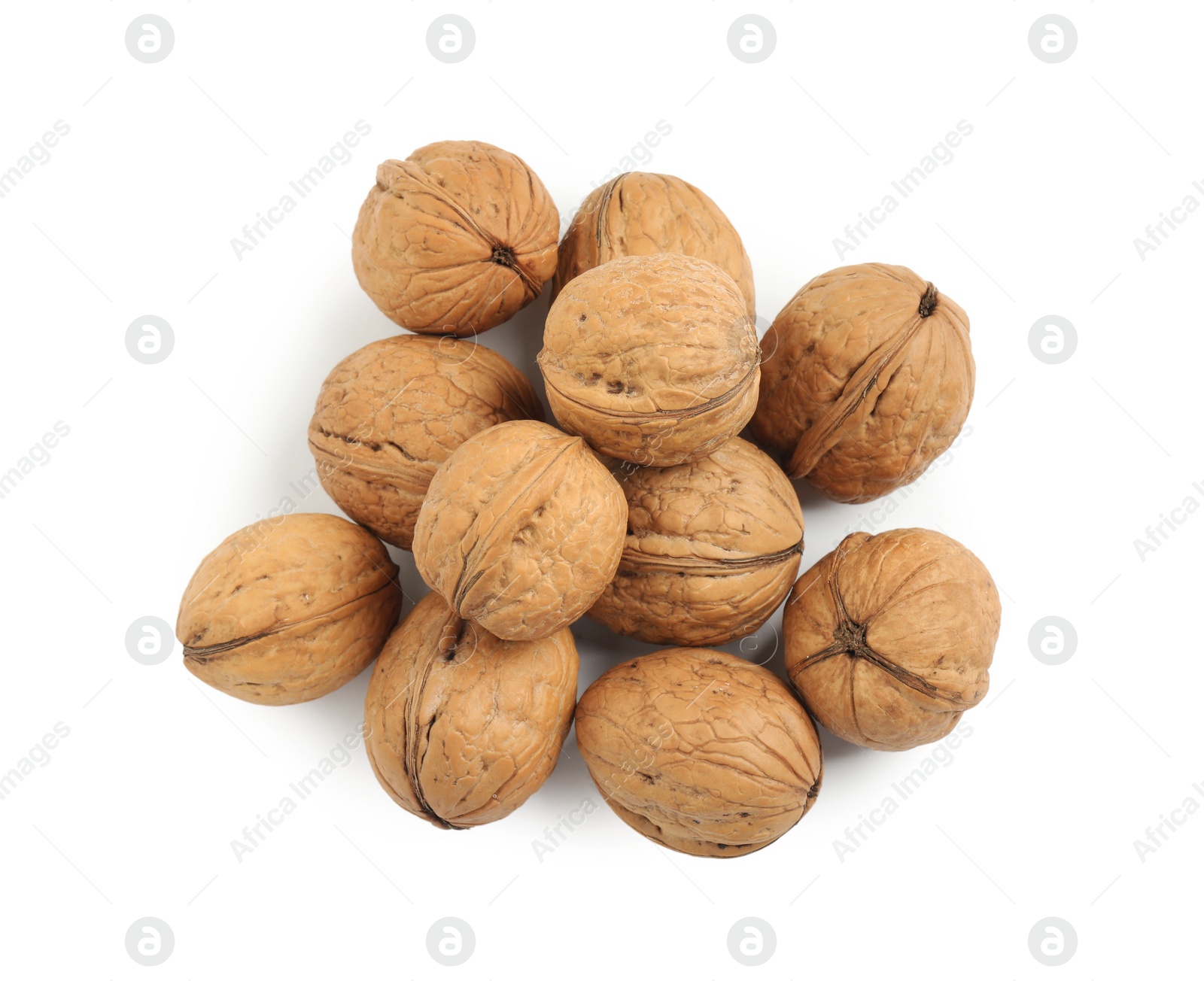 Whole walnuts in shell on white background, top view Photo of Whole walnuts in shell on white background, top view