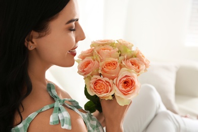Young woman with beautiful bouquet indoors, closeup Photo of Young woman with beautiful bouquet indoors, closeup