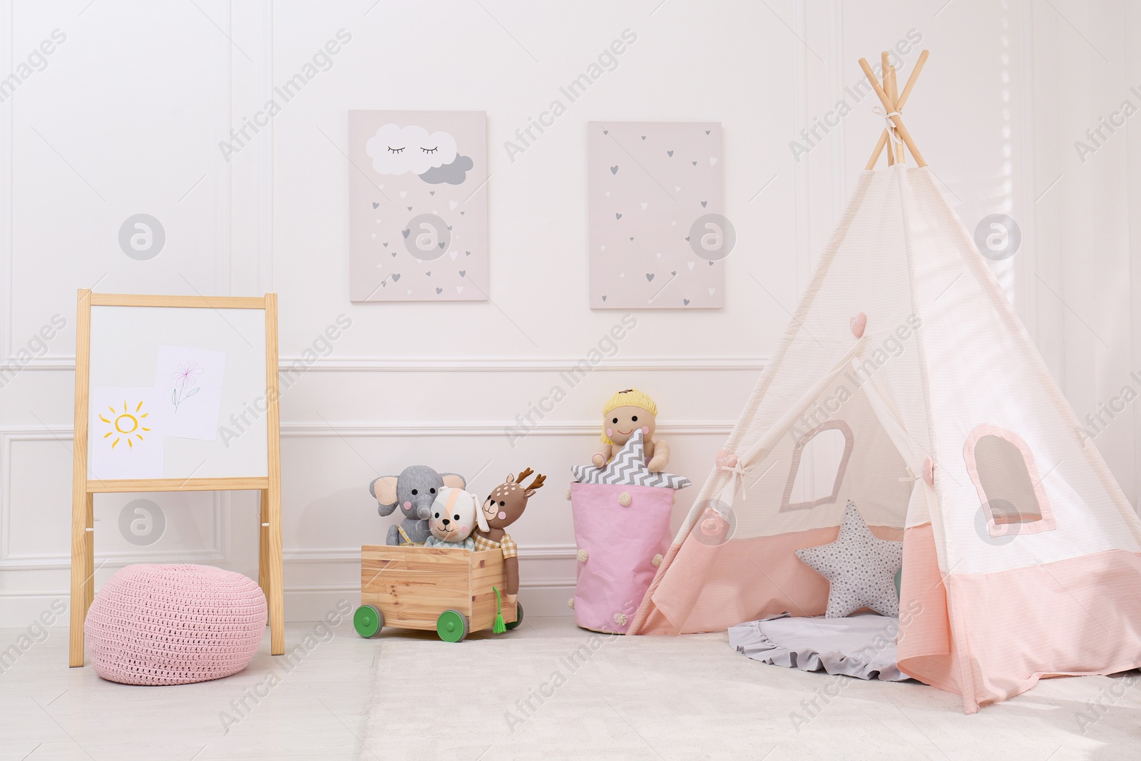 Cute child's room interior with toys, modern furniture and play tent Photo of Cute child's room interior with toys, modern furniture and play tent