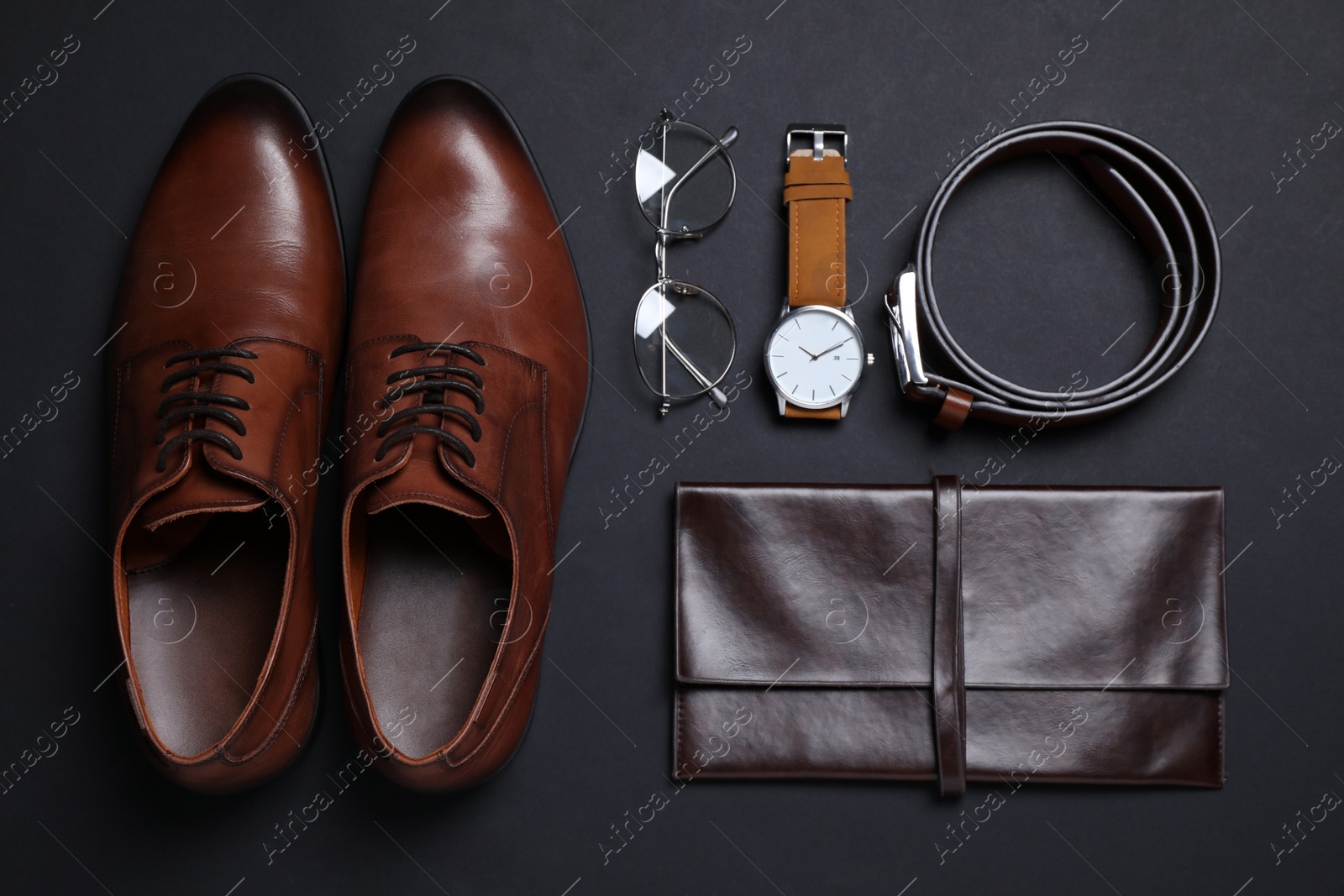 Men set with stylish accessorizes on black background, flat lay Photo of Men set with stylish accessorizes on black background, flat lay