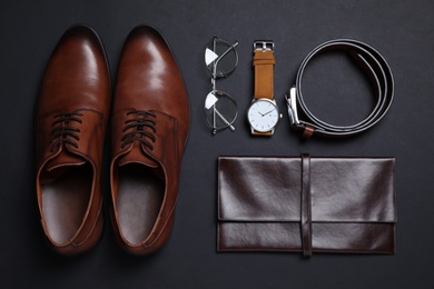 Men set with stylish accessorizes on black background, flat lay Photo of Men set with stylish accessorizes on black background, flat lay