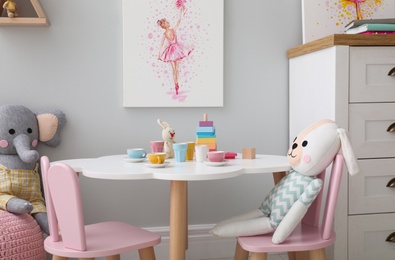 Children's room with modern furniture and picture. Interior design Photo of Children's room with modern furniture and picture. Interior design