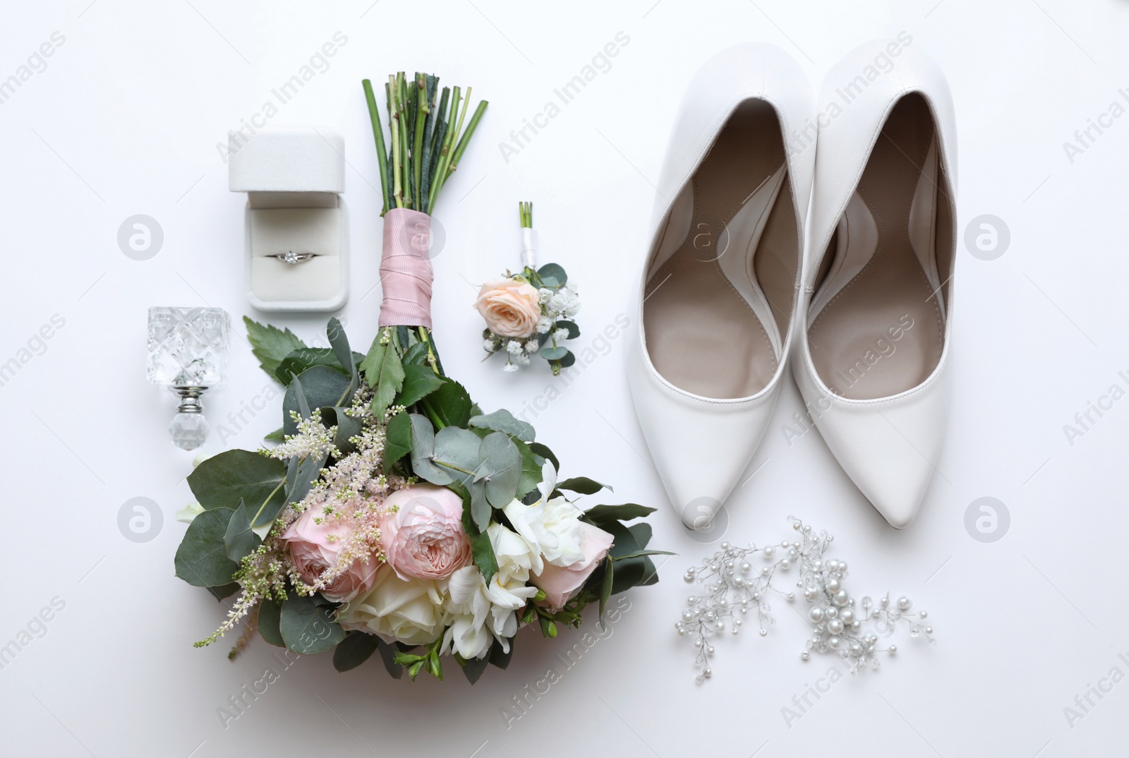 Composition with wedding high heel shoes on white background, top view Photo of Composition with wedding high heel shoes on white background, top view