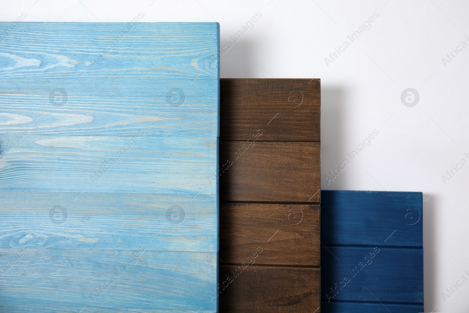 Different wooden surfaces for photography on white background, top view Photo of Different wooden surfaces for photography on white background, top view