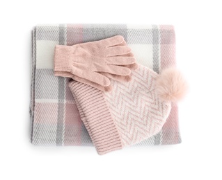 Woolen gloves, scarf and hat on white background, top view Photo of Woolen gloves, scarf and hat on white background, top view