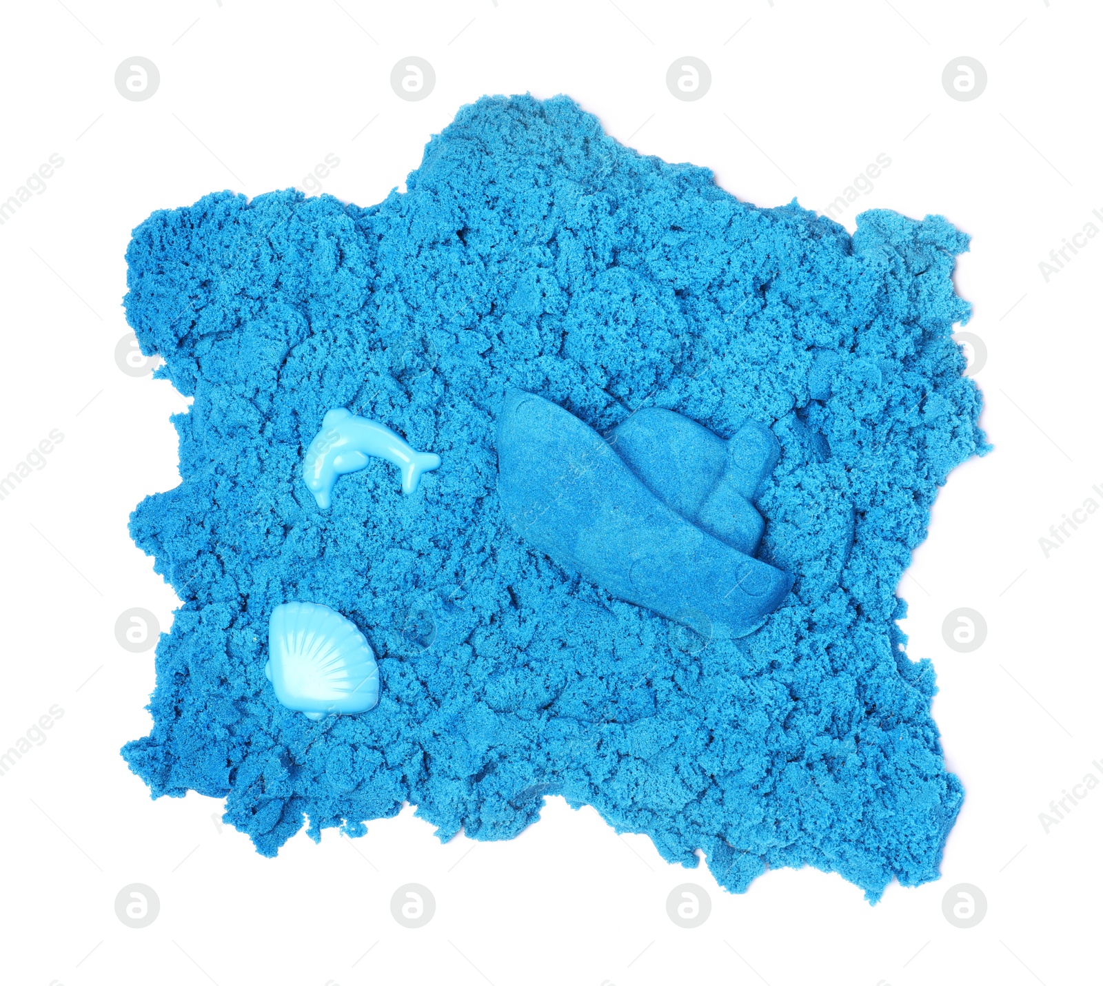 Blue kinetic sand and toys on white background, top view Photo of Blue kinetic sand and toys on white background, top view