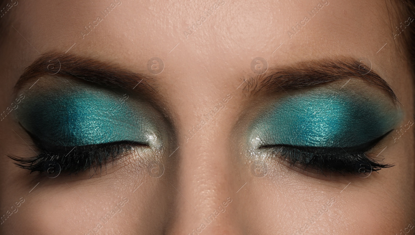 Young woman with evening makeup, closeup. Eye shadow product Photo of Young woman with evening makeup, closeup. Eye shadow product