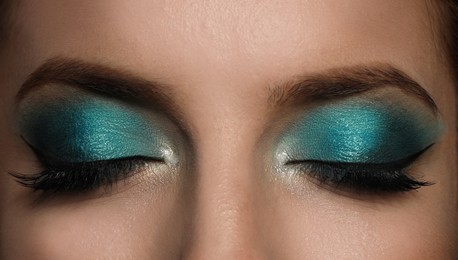 Young woman with evening makeup, closeup. Eye shadow product Photo of Young woman with evening makeup, closeup. Eye shadow product
