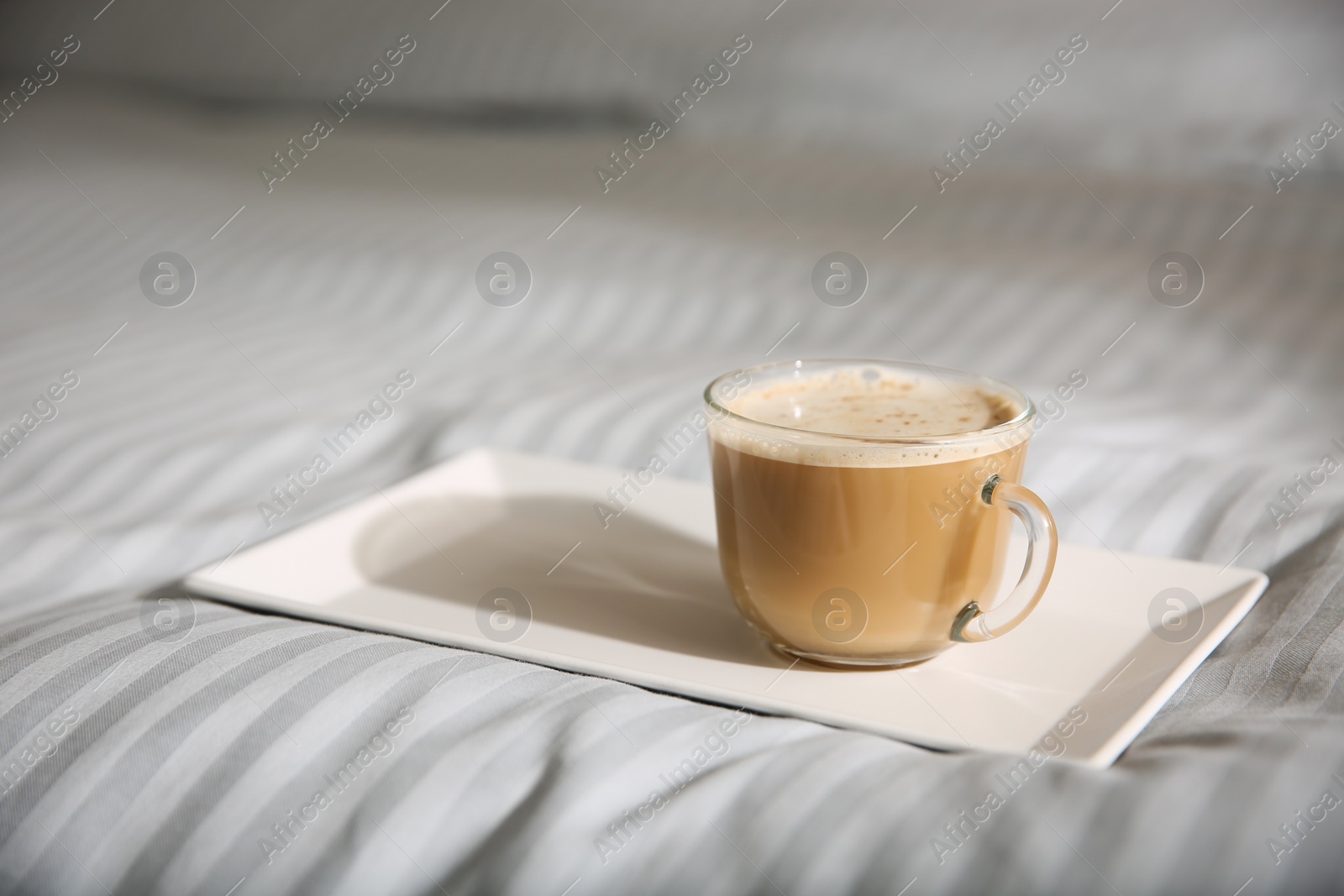 Tray with morning coffee on soft blanket. Space for text Photo of Tray with morning coffee on soft blanket. Space for text