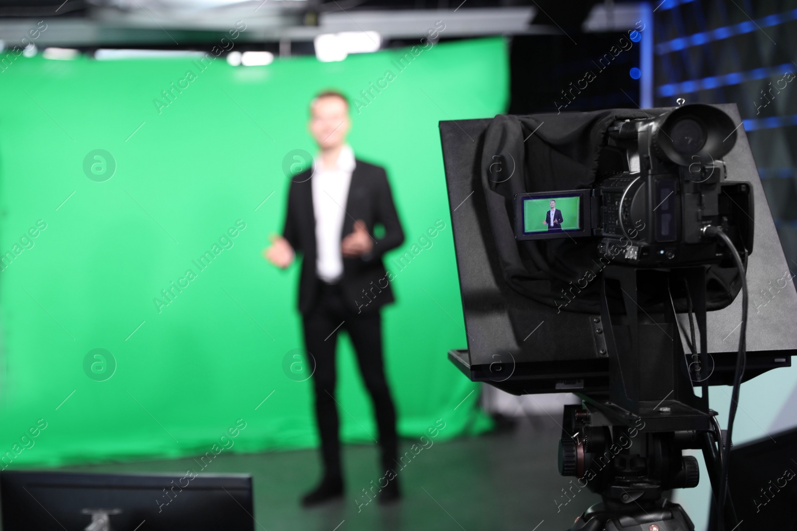 Presenter working in studio, focus on video camera Photo of Presenter working in studio, focus on video camera