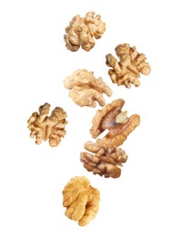 Halves of walnuts falling on white background Image of Halves of walnuts falling on white background