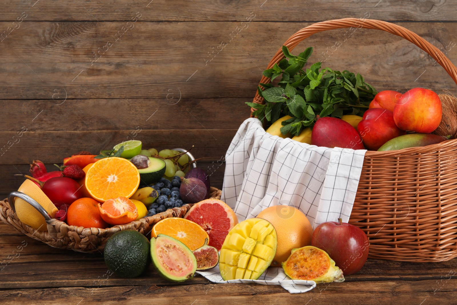 Assortment of fresh exotic fruits on wooden table Photo of Assortment of fresh exotic fruits on wooden table