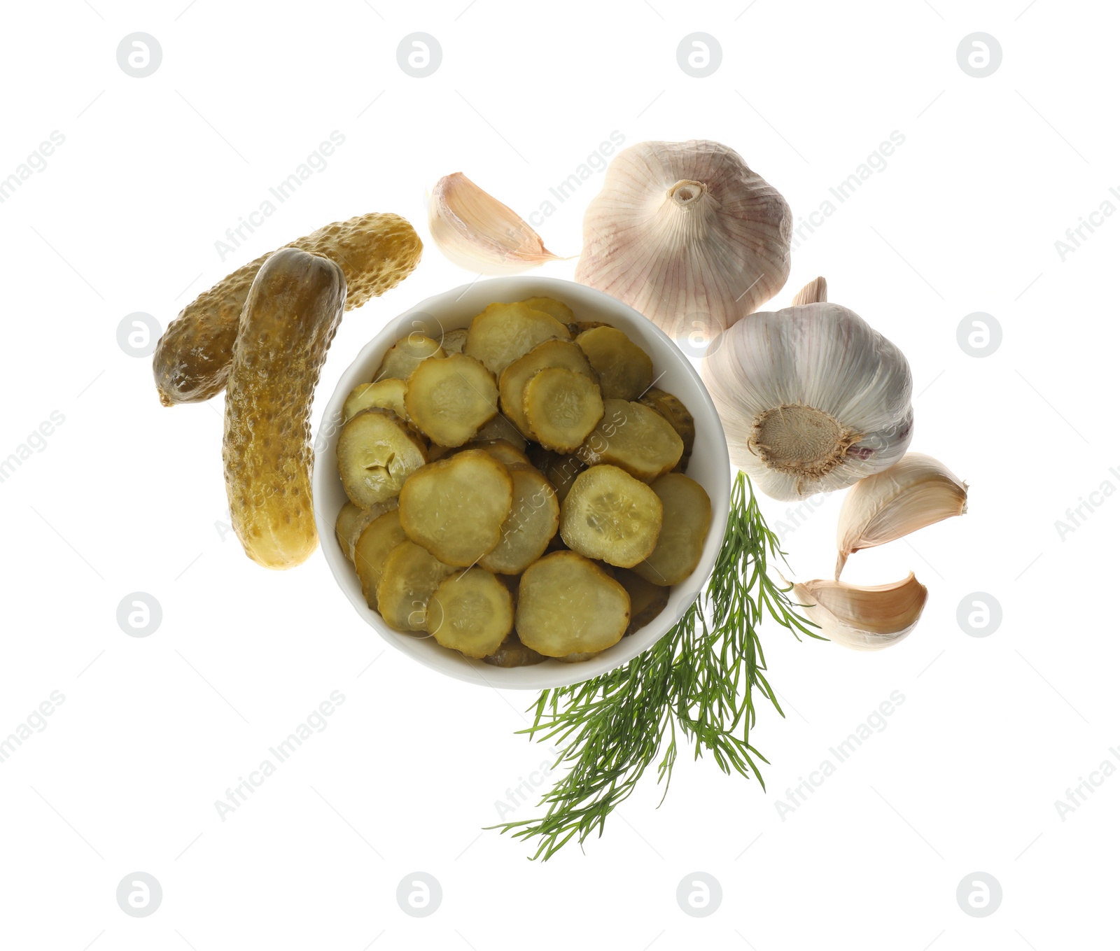 Tasty pickled cucumbers, garlic and dill on white background, top view Photo of Tasty pickled cucumbers, garlic and dill on white background, top view
