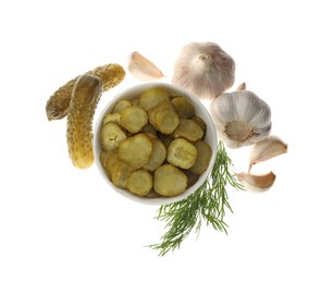 Photo of Tasty pickled cucumbers, garlic and dill on white background, top view
