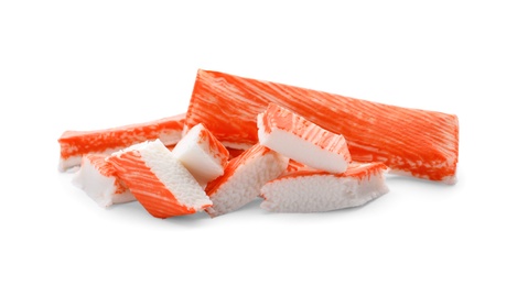 Cut and whole crab sticks isolated on white Photo of Cut and whole crab sticks isolated on white