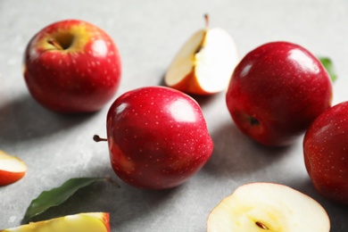 Fresh ripe red apples on light grey background Photo of Fresh ripe red apples on light grey background