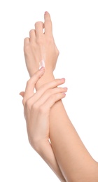 Young woman applying body cream on white background Photo of Young woman applying body cream on white background