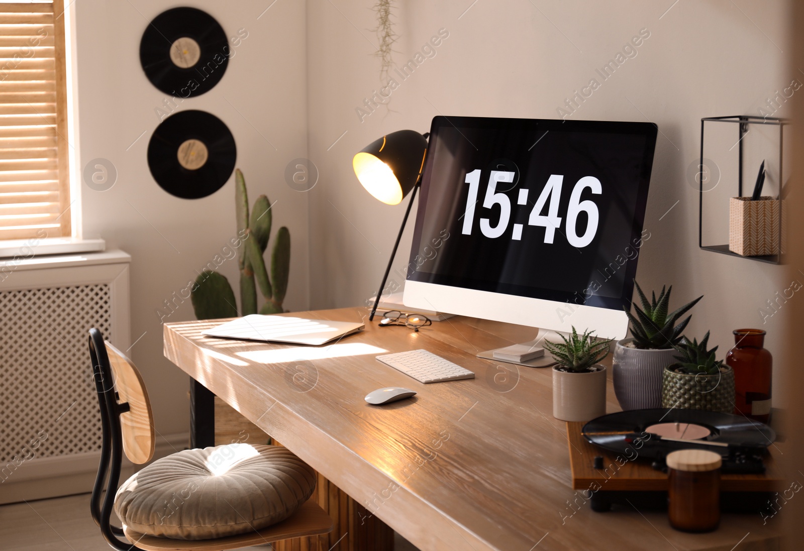 Room interior with comfortable workplace. Modern computer on wooden desk Photo of Room interior with comfortable workplace. Modern computer on wooden desk