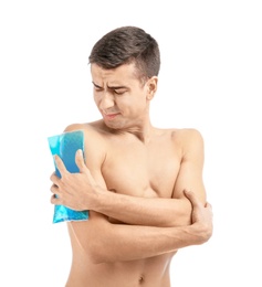 Photo of Young man applying cold compress to shoulder on white background