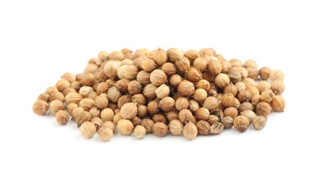 Heap of dried coriander seeds on white background Photo of Heap of dried coriander seeds on white background