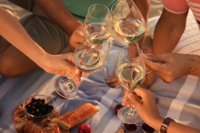 Group of friends having picnic outdoors, closeup Photo of Group of friends having picnic outdoors, closeup