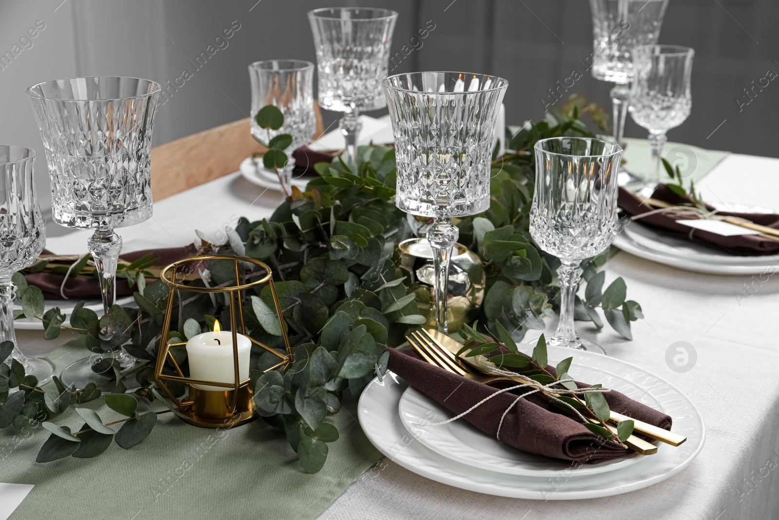 Stylish elegant table setting for festive dinner indoors Photo of Stylish elegant table setting for festive dinner indoors