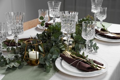 Stylish elegant table setting for festive dinner indoors Photo of Stylish elegant table setting for festive dinner indoors