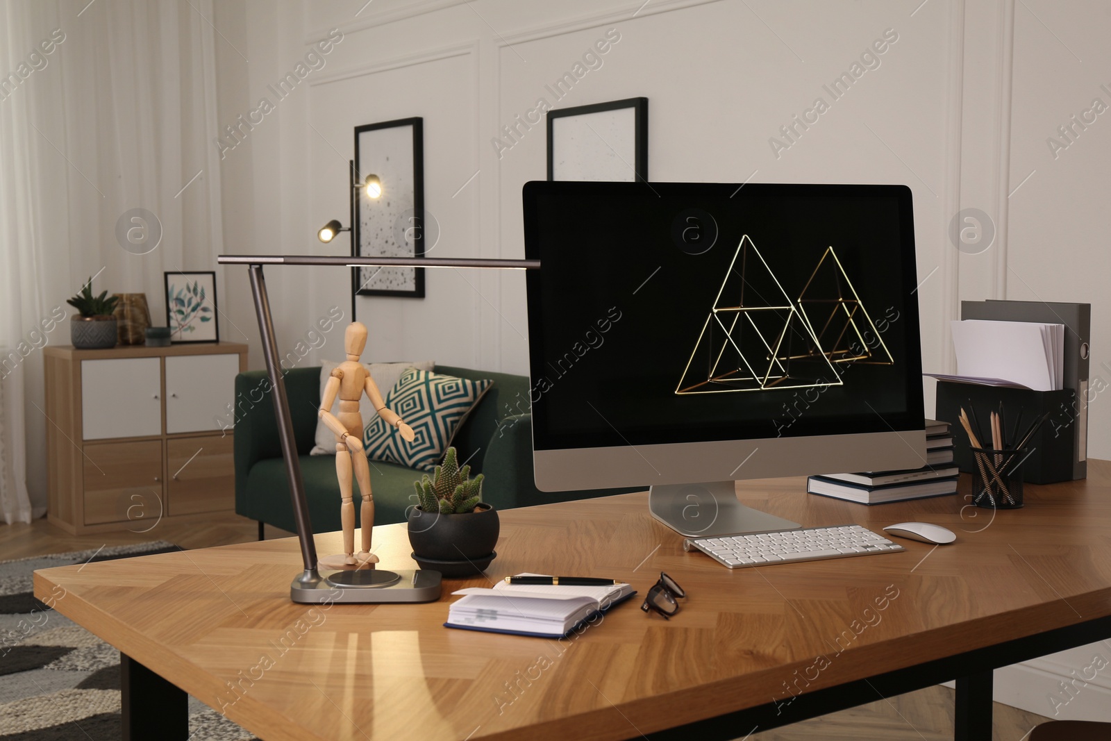 Workplace with computer on wooden desk in light room. Modern interior design Photo of Workplace with computer on wooden desk in light room. Modern interior design