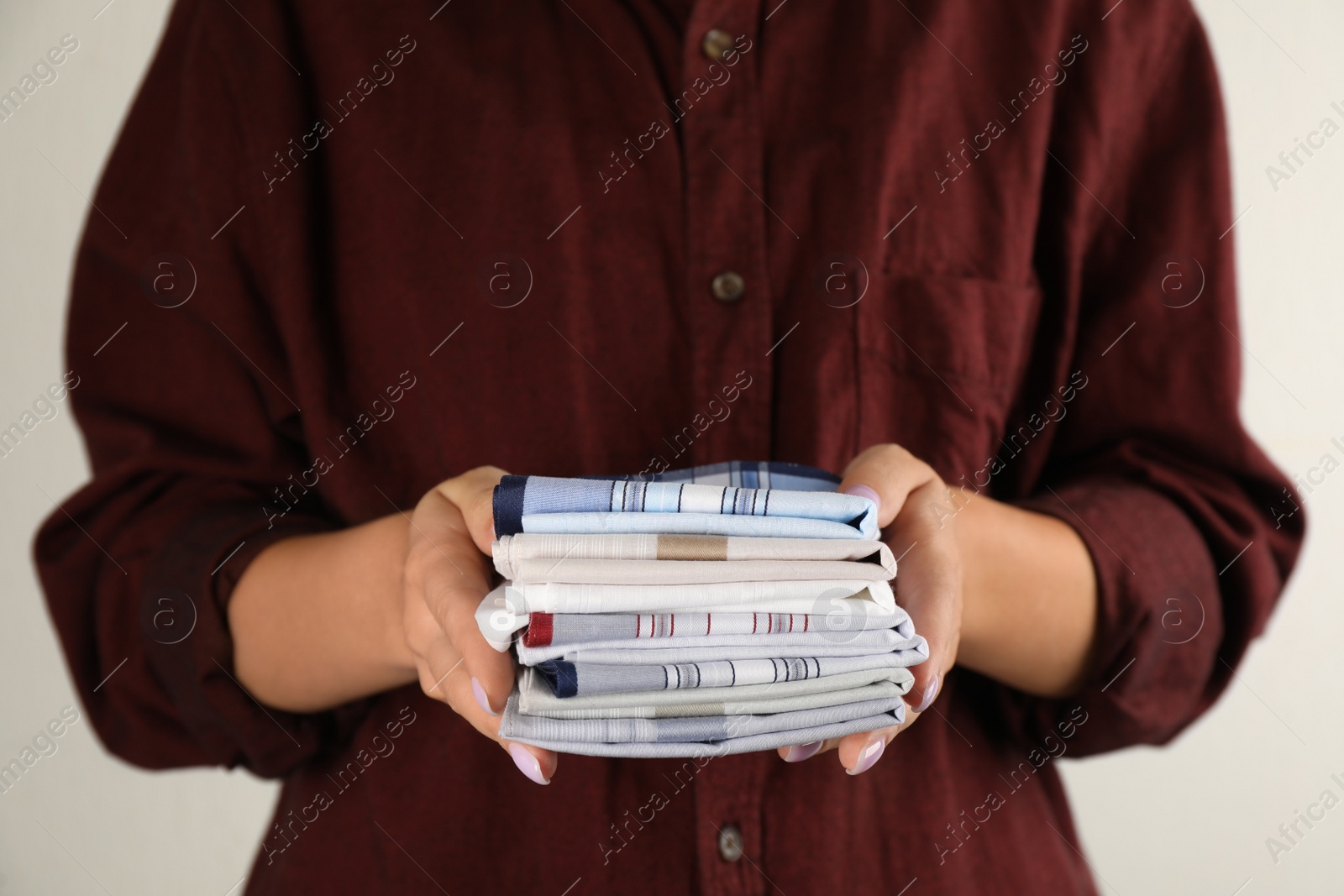 Woman holding many different handkerchiefs in hands, closeup Photo of Woman holding many different handkerchiefs in hands, closeup
