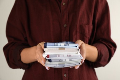 Woman holding many different handkerchiefs in hands, closeup Photo of Woman holding many different handkerchiefs in hands, closeup
