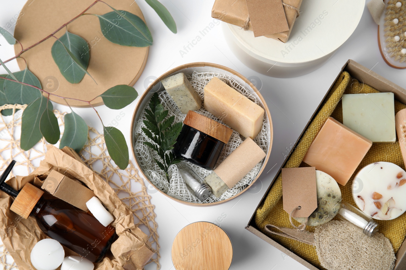 Cardboard boxes with eco friendly personal care products on white background, top view Photo of Cardboard boxes with eco friendly personal care products on white background, top view