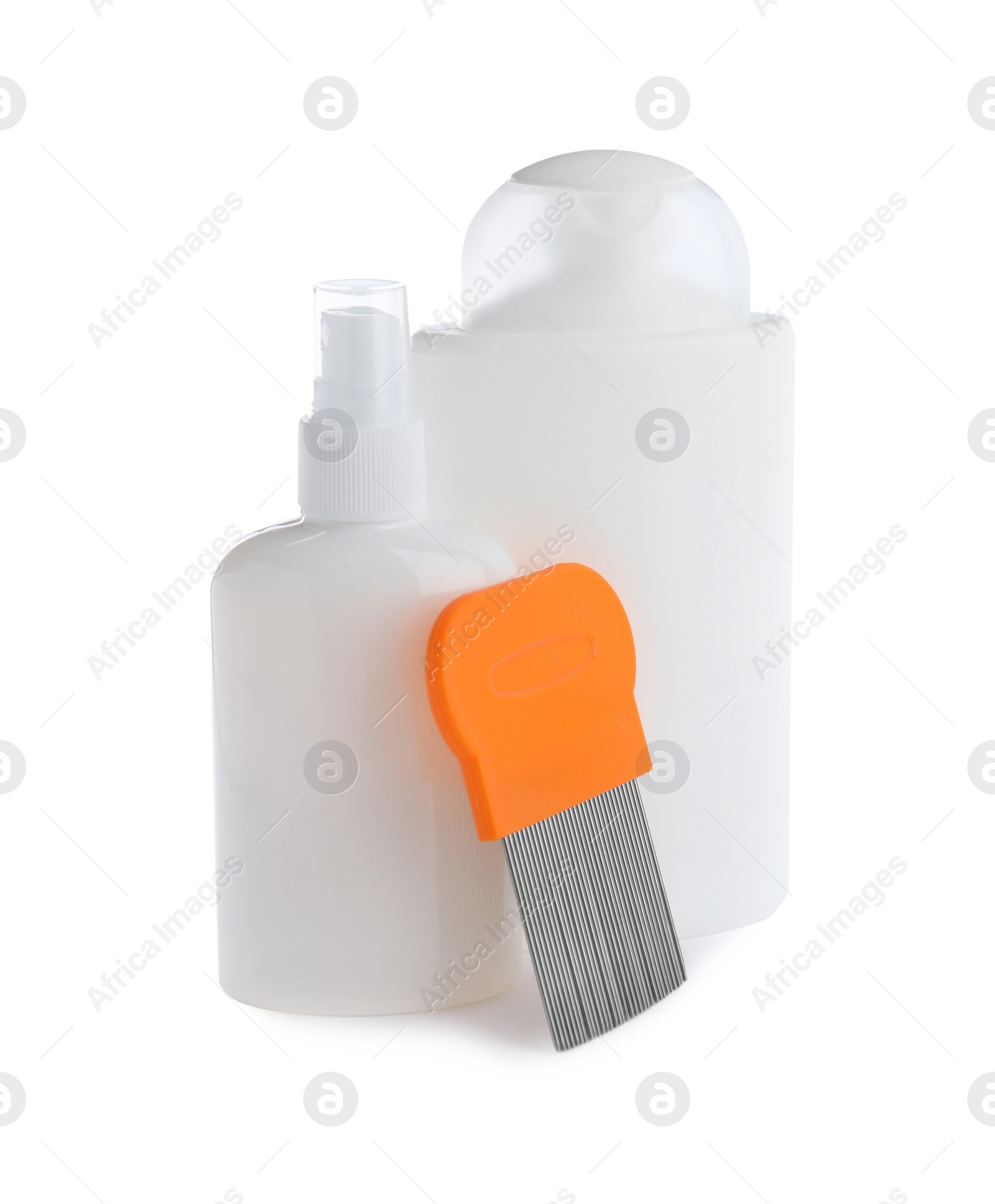Products for anti lice treatment and metal comb on white background Photo of Products for anti lice treatment and metal comb on white background