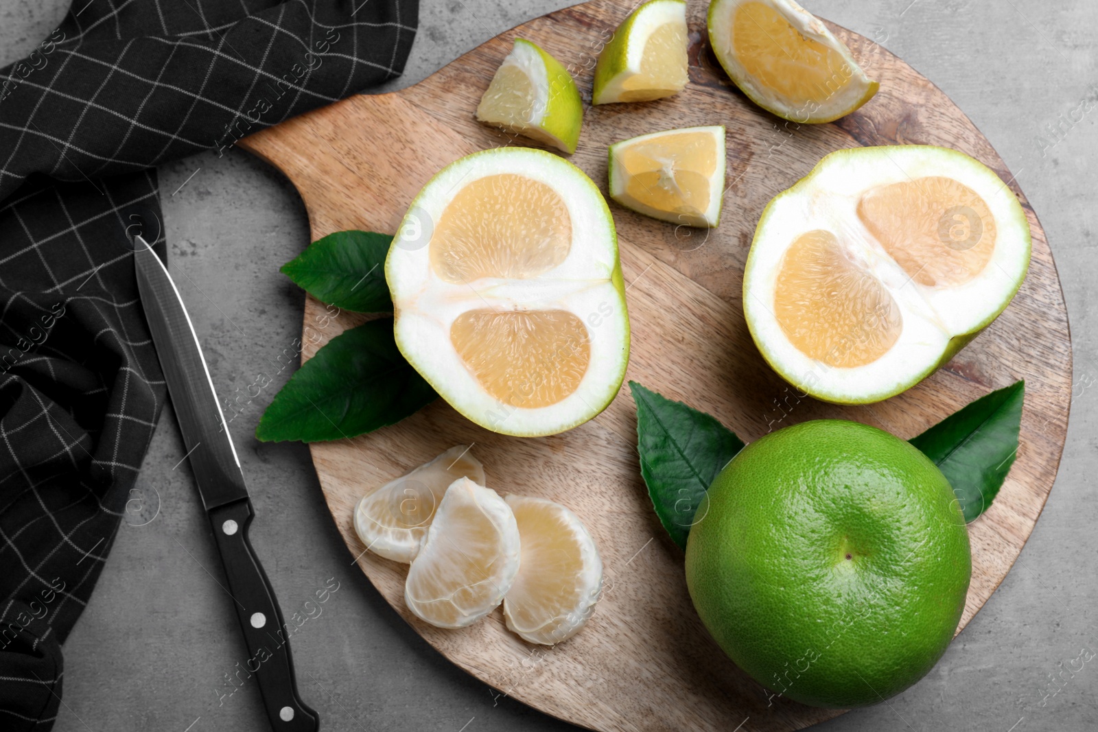 Flat lay composition with sweetie fruits on grey table Photo of Flat lay composition with sweetie fruits on grey table