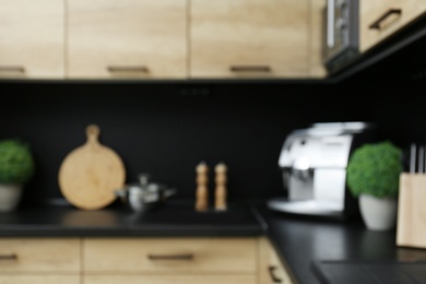 Blurred view of kitchen interior with modern furniture Photo of Blurred view of kitchen interior with modern furniture