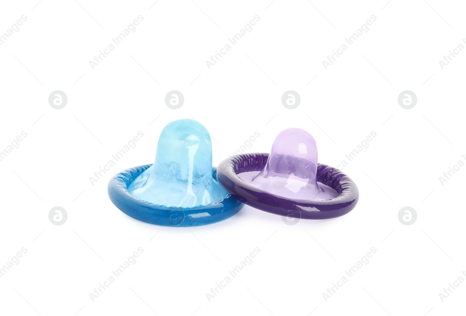 Unpacked colorful condoms on white background. Safe sex Photo of Unpacked colorful condoms on white background. Safe sex