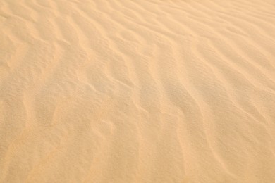 Beautiful view of rippled sandy surface in desert as background Photo of Beautiful view of rippled sandy surface in desert as background