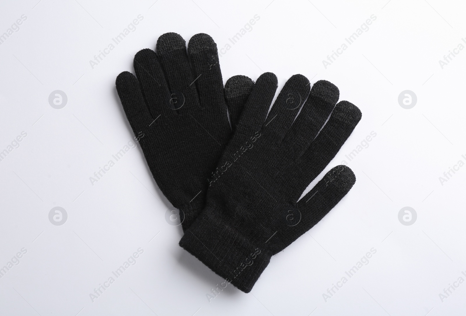 Pair of stylish woolen gloves on white background, flat lay Photo of Pair of stylish woolen gloves on white background, flat lay