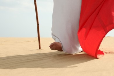 Jesus Christ walking in desert, closeup view Photo of Jesus Christ walking in desert, closeup view
