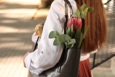 Woman with leather shopper bag outdoors, closeup Photo of Woman with leather shopper bag outdoors, closeup