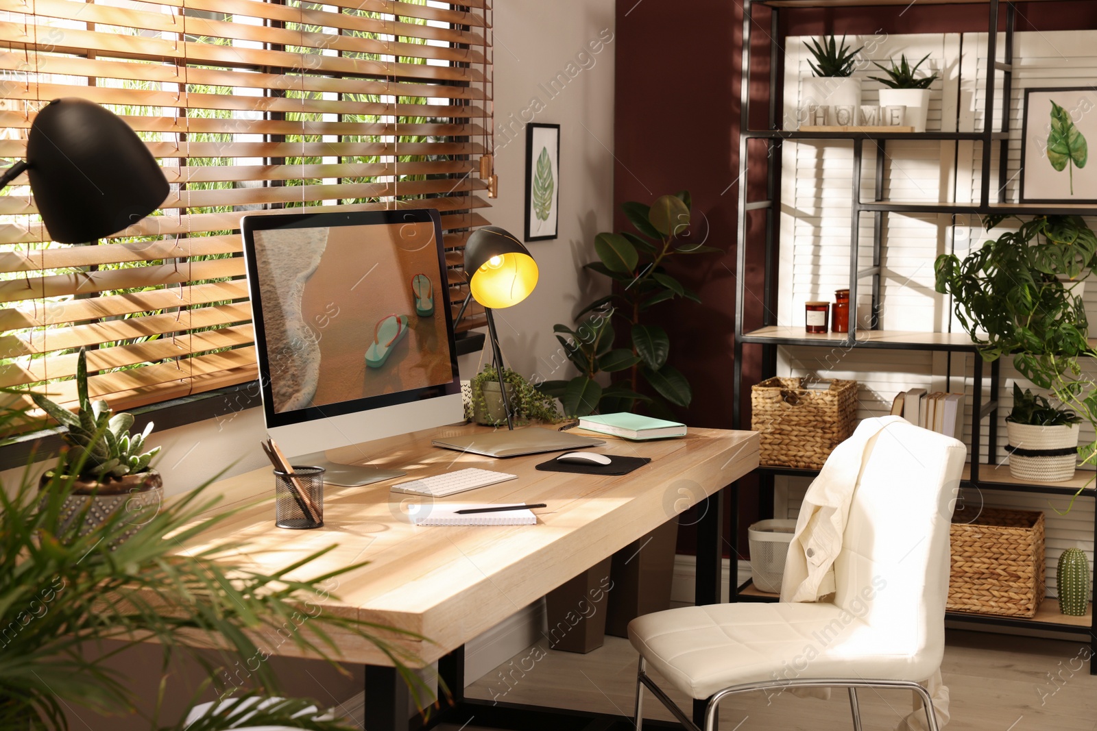 Light room interior with comfortable workplace near window Photo of Light room interior with comfortable workplace near window