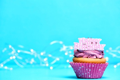 Birthday cupcake on color background Photo of Birthday cupcake on color background