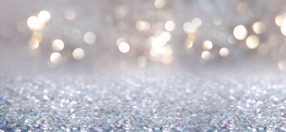Shiny glitter and blurred lights on background, banner design. Bokeh effect Image of Shiny glitter and blurred lights on background, banner design. Bokeh effect