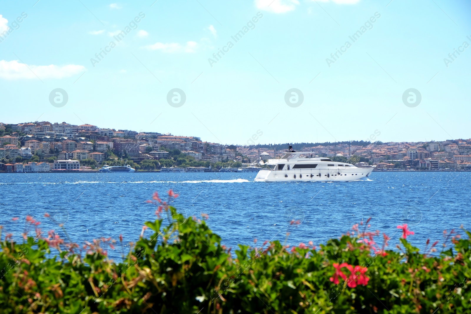 Beautiful view of sea, boat and blue sky on sunny day Photo of Beautiful view of sea, boat and blue sky on sunny day